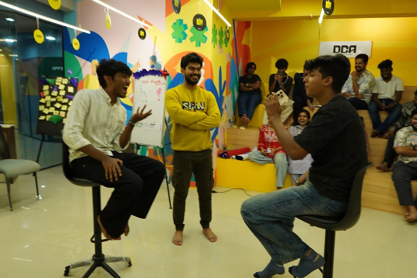 A live session at DCA, students watching from the steps